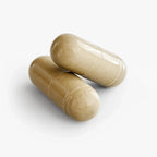 Two beige supplement capsules on white background