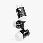 Beard growth capsules in white bottles with black labels, promoting natural beard care.