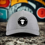Gray cap with Deadman's Beard Co. logo, featuring a bearded skull design.