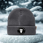 Grey waffle knit beanie with Deadman's Beard Co. logo, set in snowy winter scene